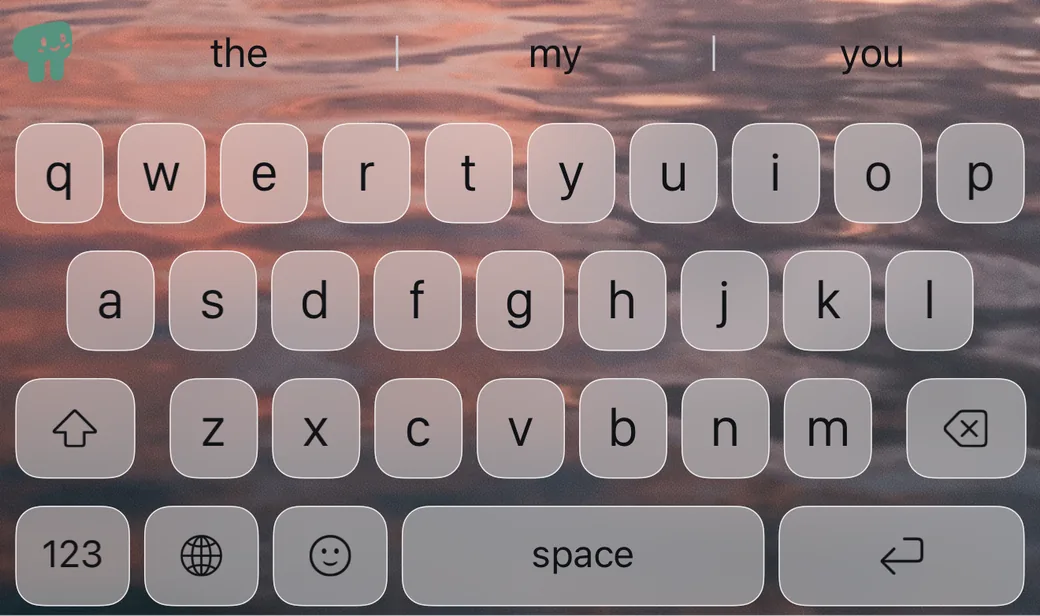 Frosted-glass keys over a photo of a dusk sky reflected in water.